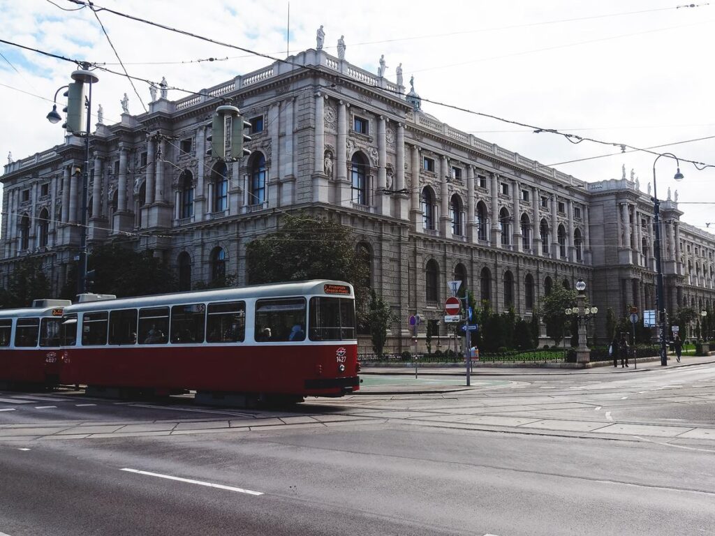 Red Vienna tram passing the Kunsthistorisches Museum near Burgring