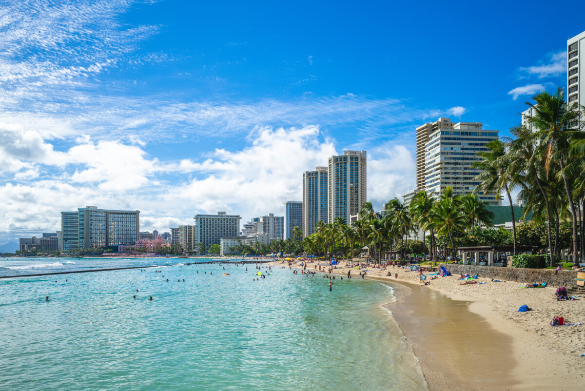 Waikiki beach view, beachgoers, and skyline at Oahu, Hawaii