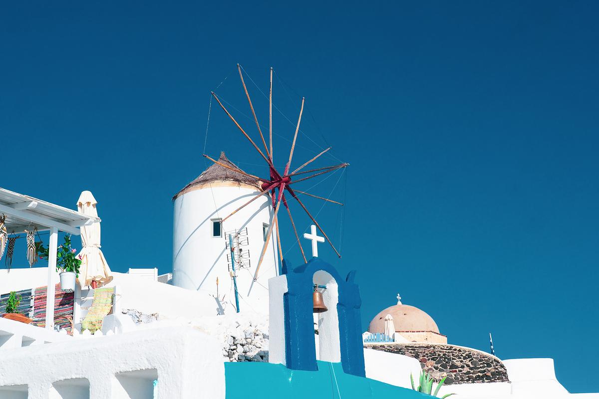 Oia windmill above the Santorini caldera at sunset