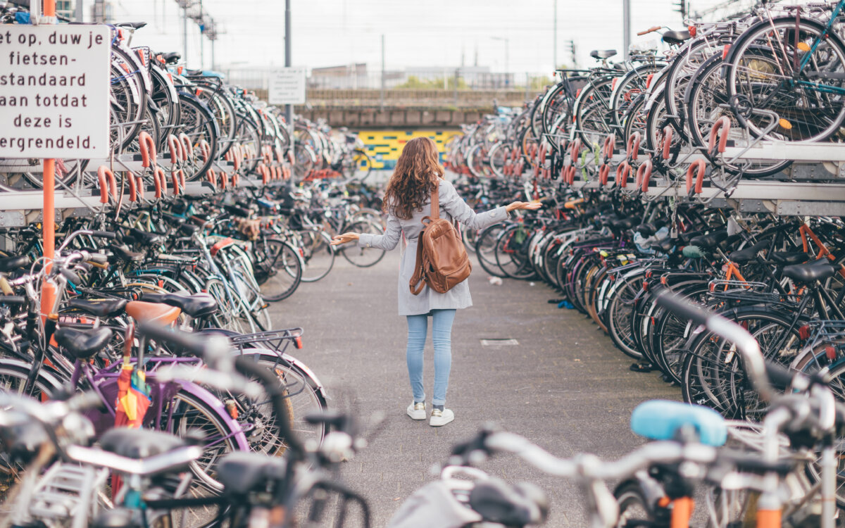 Woman Wondering where her bike is at bike parking in Eindhoven