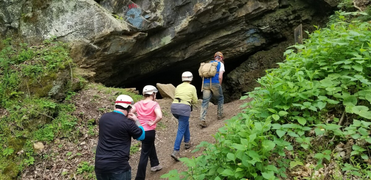 Group walking into Worley's Cave