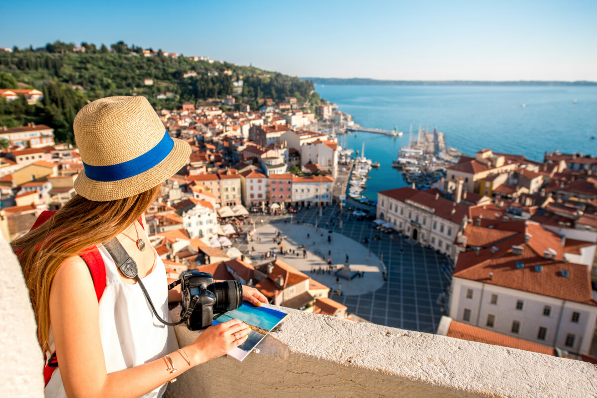 Female traveler with camera traveling in Slovenia